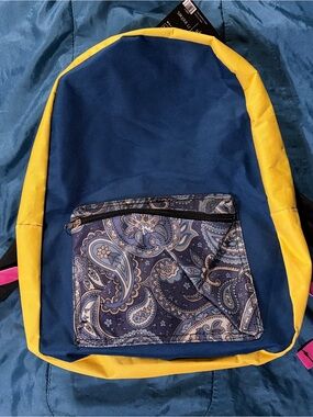 Navy blue and yellow Moda West backpack with paisley front pocket